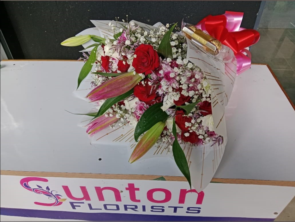 Sunton Florists team arranging beautiful flowers in Nairobi shop